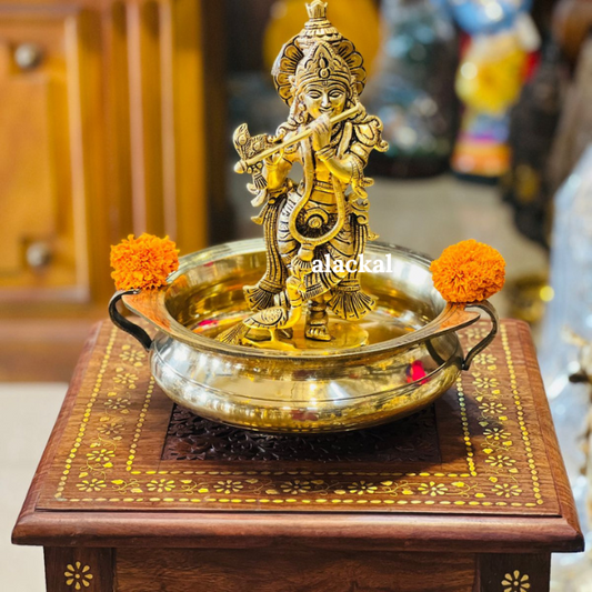 BRASS CUTE KRISHNA IDOL WITH LIGHTWEIGHT URULI FOR VISHUKANI SETTING IN A SMALL PUJA ROOM