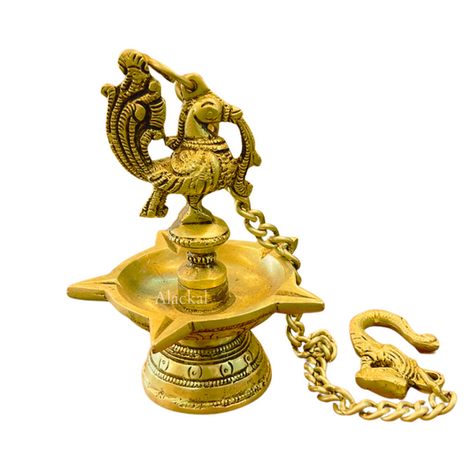 Handmade brass hanging diya with peacock head and 5 wicks – perfect for Navaratri decor from Alackal Bell Metals Mannar