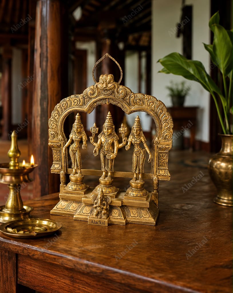 Handcrafted brass idol of Lord Murugan (Kartikeya) seated with Valli and Deivanai for home temple, pooja room, Hindu spiritual décor, and auspicious gifting.