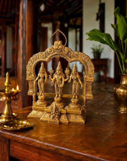 Handcrafted brass idol of Lord Murugan (Kartikeya) seated with Valli and Deivanai for home temple, pooja room, Hindu spiritual décor, and auspicious gifting.