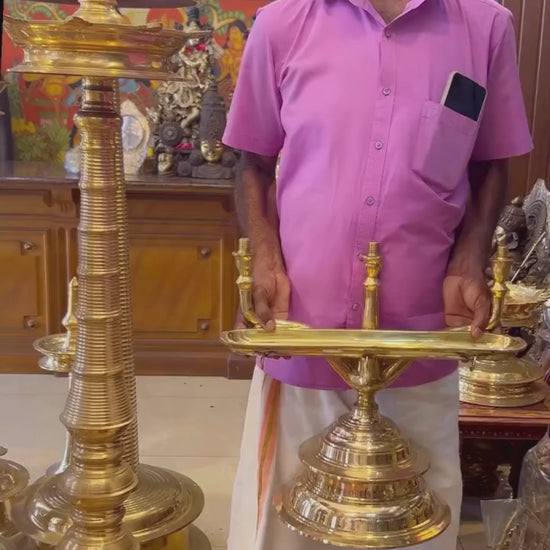 Handmade Kerala Bronze Maha Kavaravilakku – Combination of Kavaravilakku, Paathivilakku, Thookkuvilakku – Alackal Bell Metals Mannar.Temple Lighting with Maha Kavaravilakku During Deeparadhana – Kerala Temple Décor